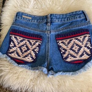 Denim mini shorts with Aztec print back pockets
